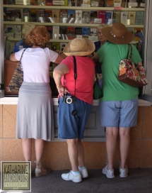 Three Traveling Women getting advice at the Information Booth in Santa Fe, New Mexico.